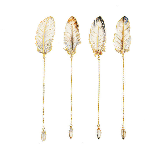 Four feather bookmarks in assorted openwork patterns