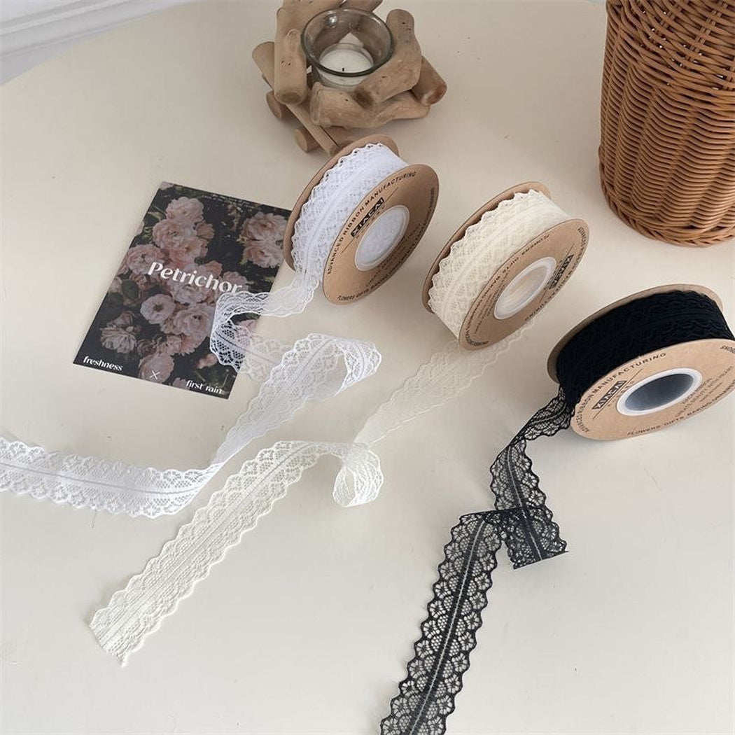 White off-white and black lace ribbon rolls