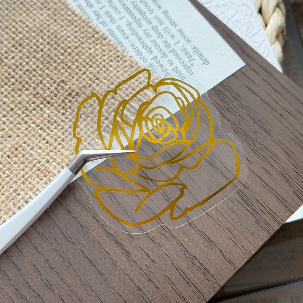 Gold botanical line art sticker close-up