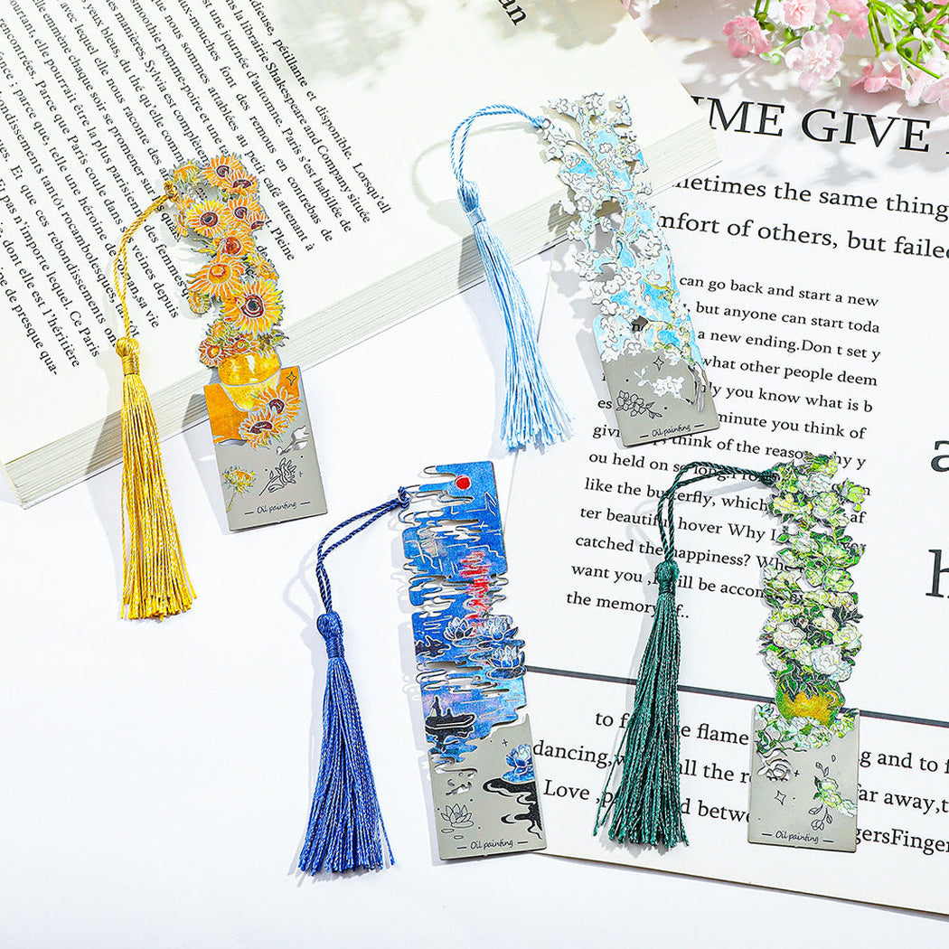 Four art print bookmarks on an open book
