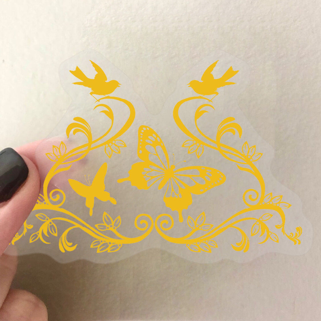 Gold botanical and insect sticker close-up