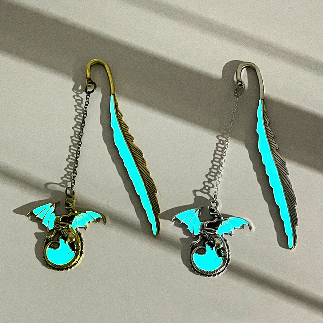 Two glowing dragon feather bookmarks