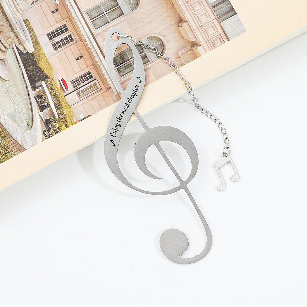 Treble clef bookmark shown on a book