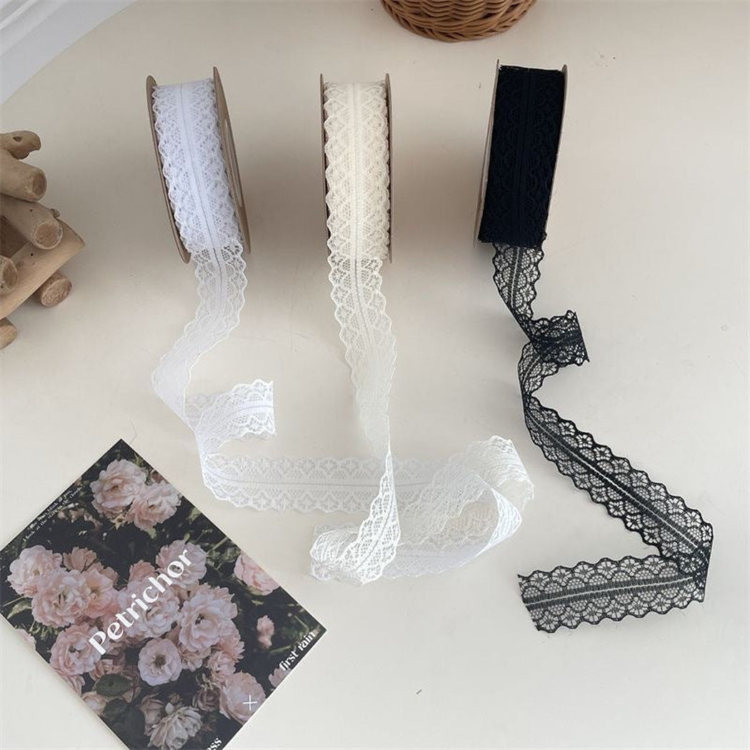 White off-white and black lace ribbon samples