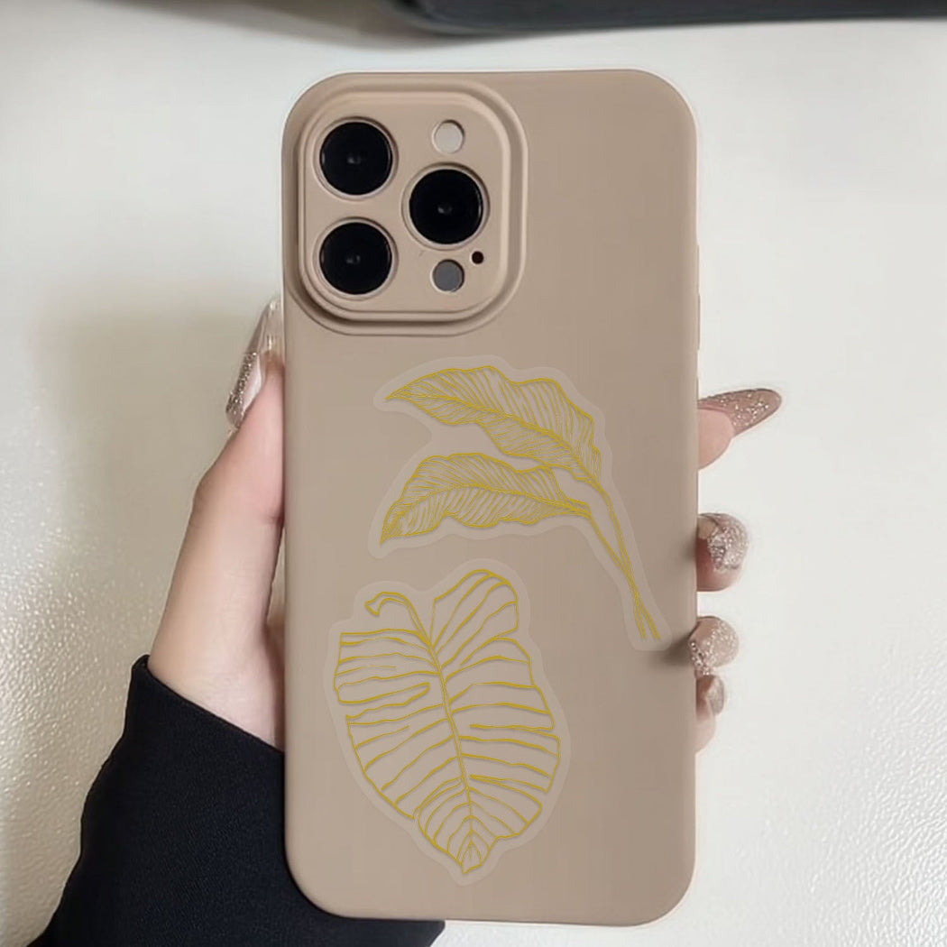 Gold botanical line art stickers shown in use