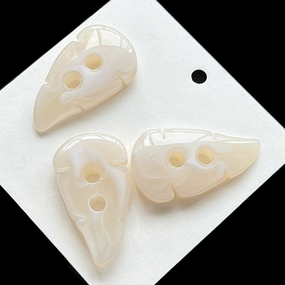 Cream leaf buttons on blank card