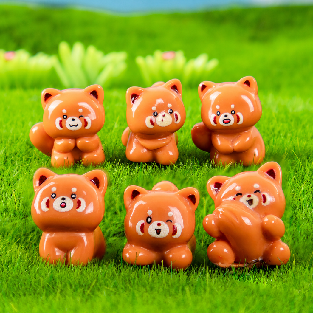 objella - orange six-pose raccoon figurine staged product scene