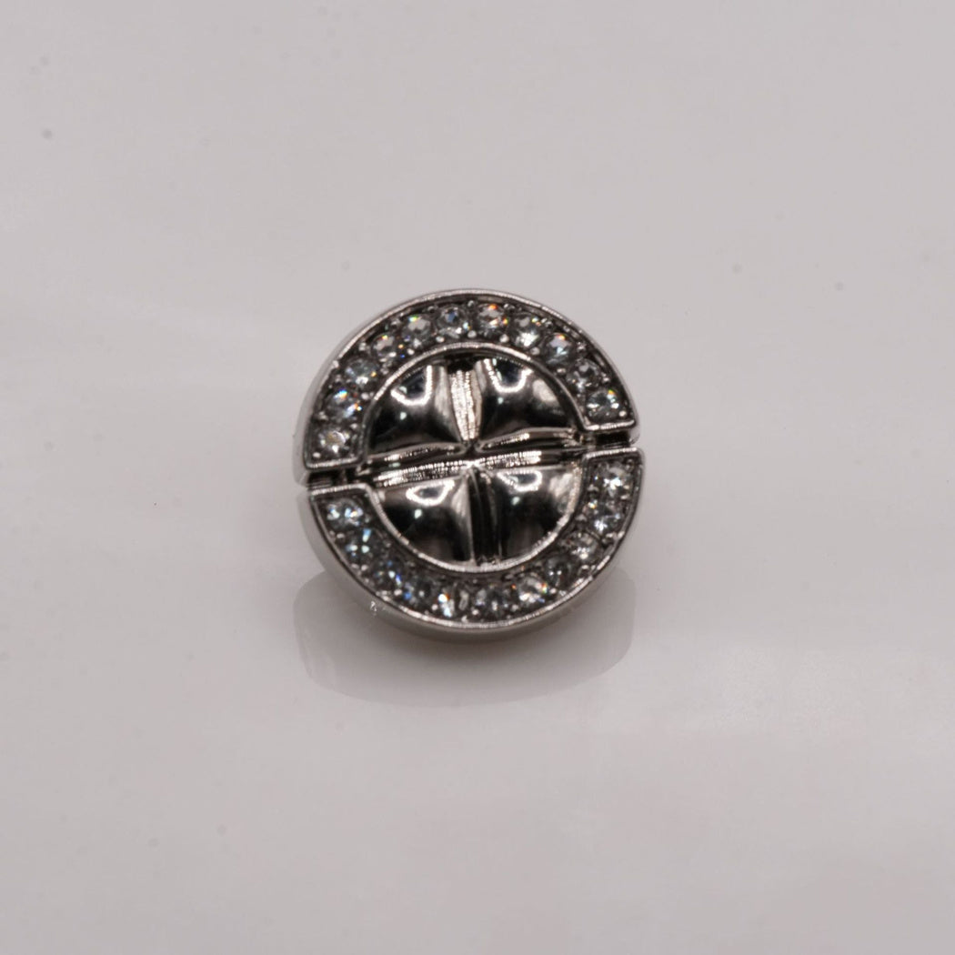 Silver-tone segmented round button with divided center and clear outer arcs