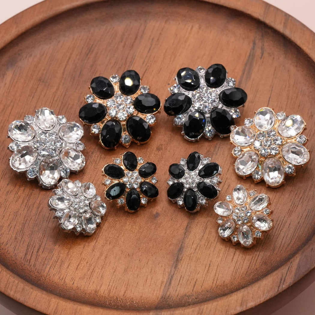 Flower buttons in black and clear faceted styles with gold-tone and silver-tone settings