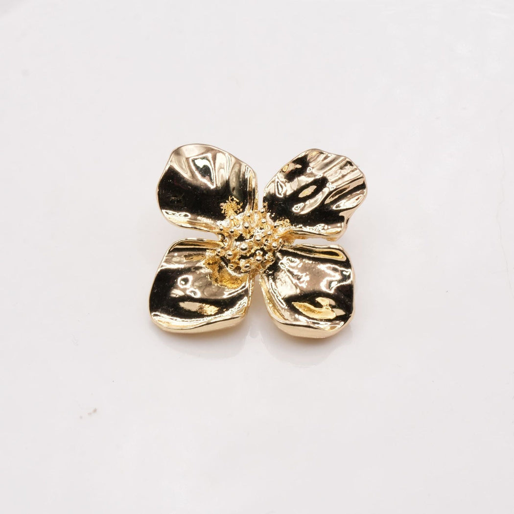 Gold-tone four-petal flower button with cupped petals and a raised center