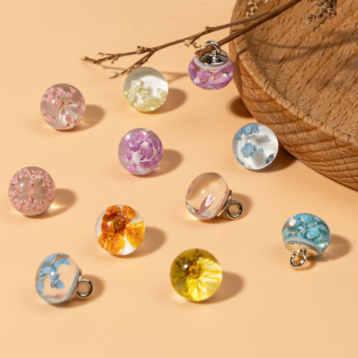 Assorted clear orb shank buttons with botanical and reflective insets
