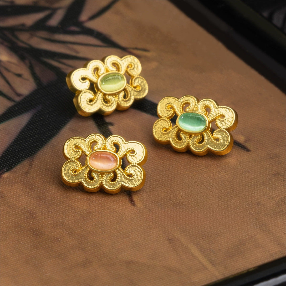 Ornate cloud buttons with assorted oval centers