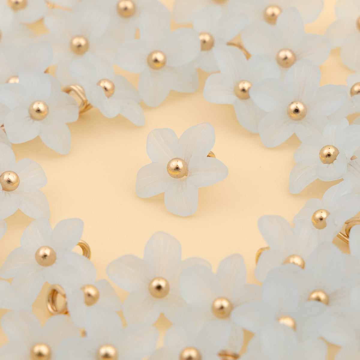 Pale blue five petal shank buttons