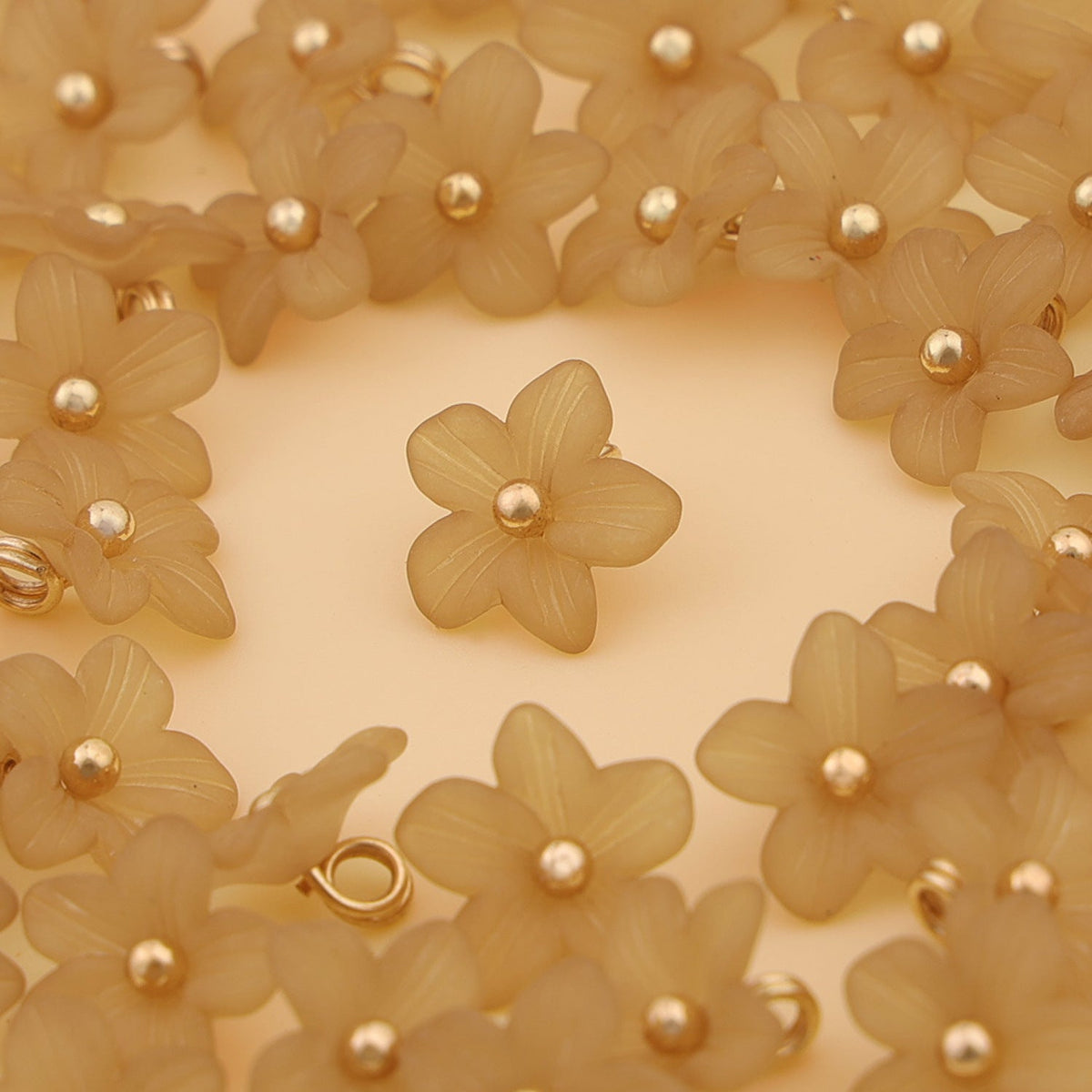 Light brown five petal shank buttons