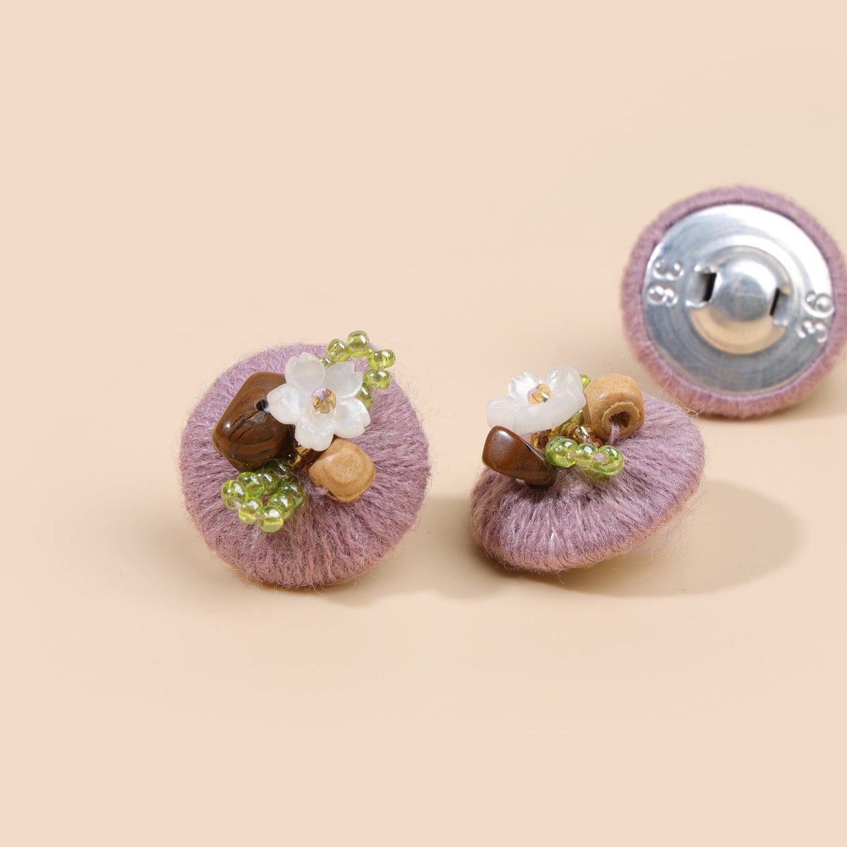 Soft lilac beaded floral round button from three views