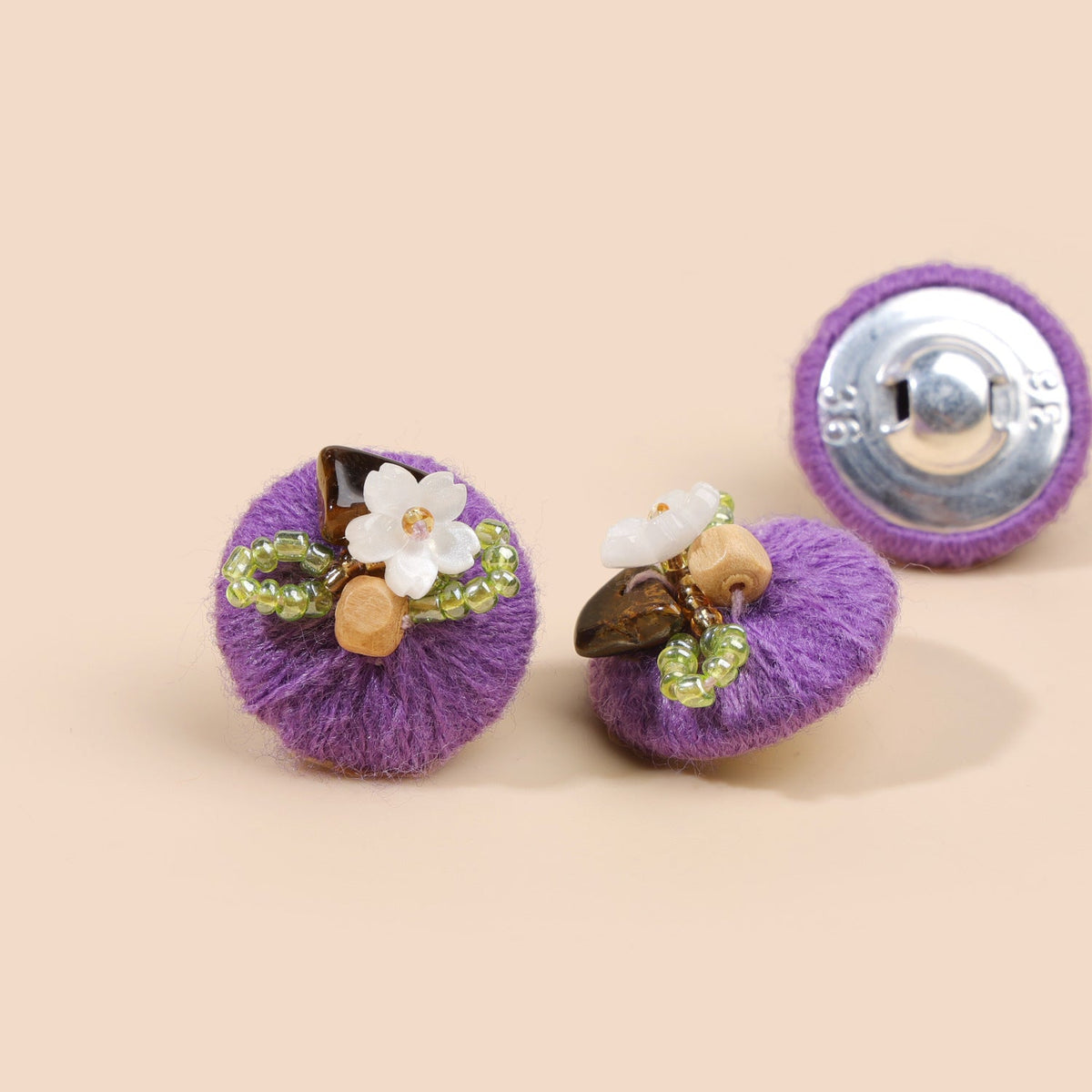Royal purple beaded floral round button from three views