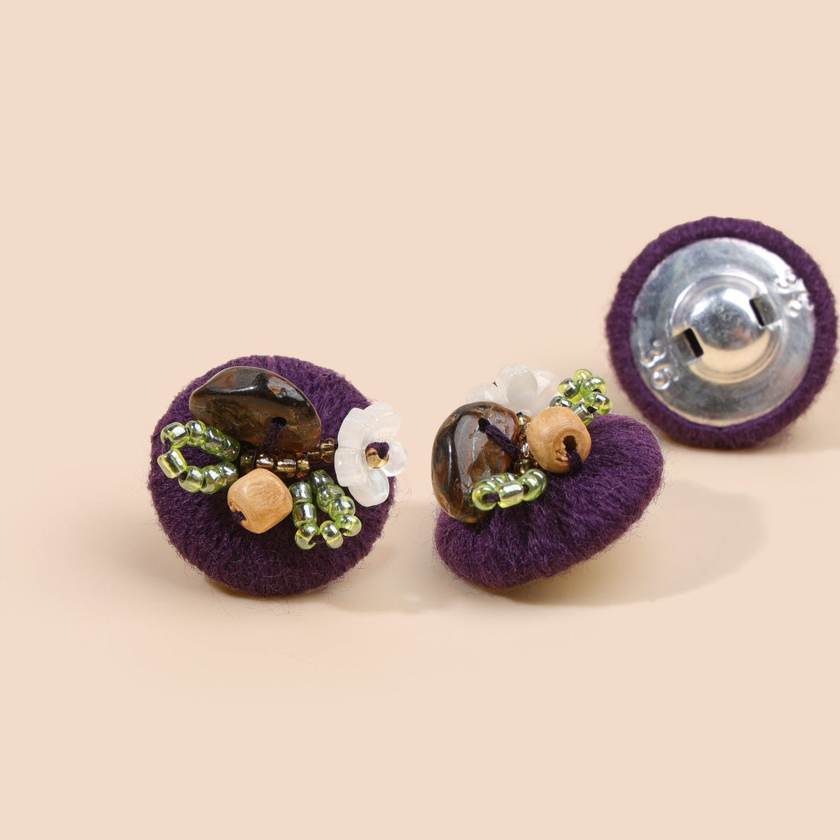 Deep purple beaded floral round button from three views
