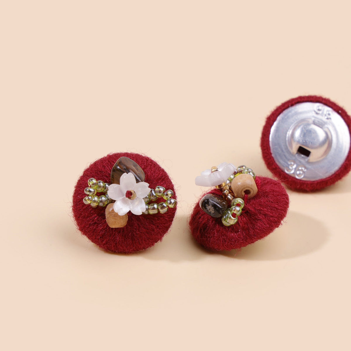 Wine red beaded floral round button from three views