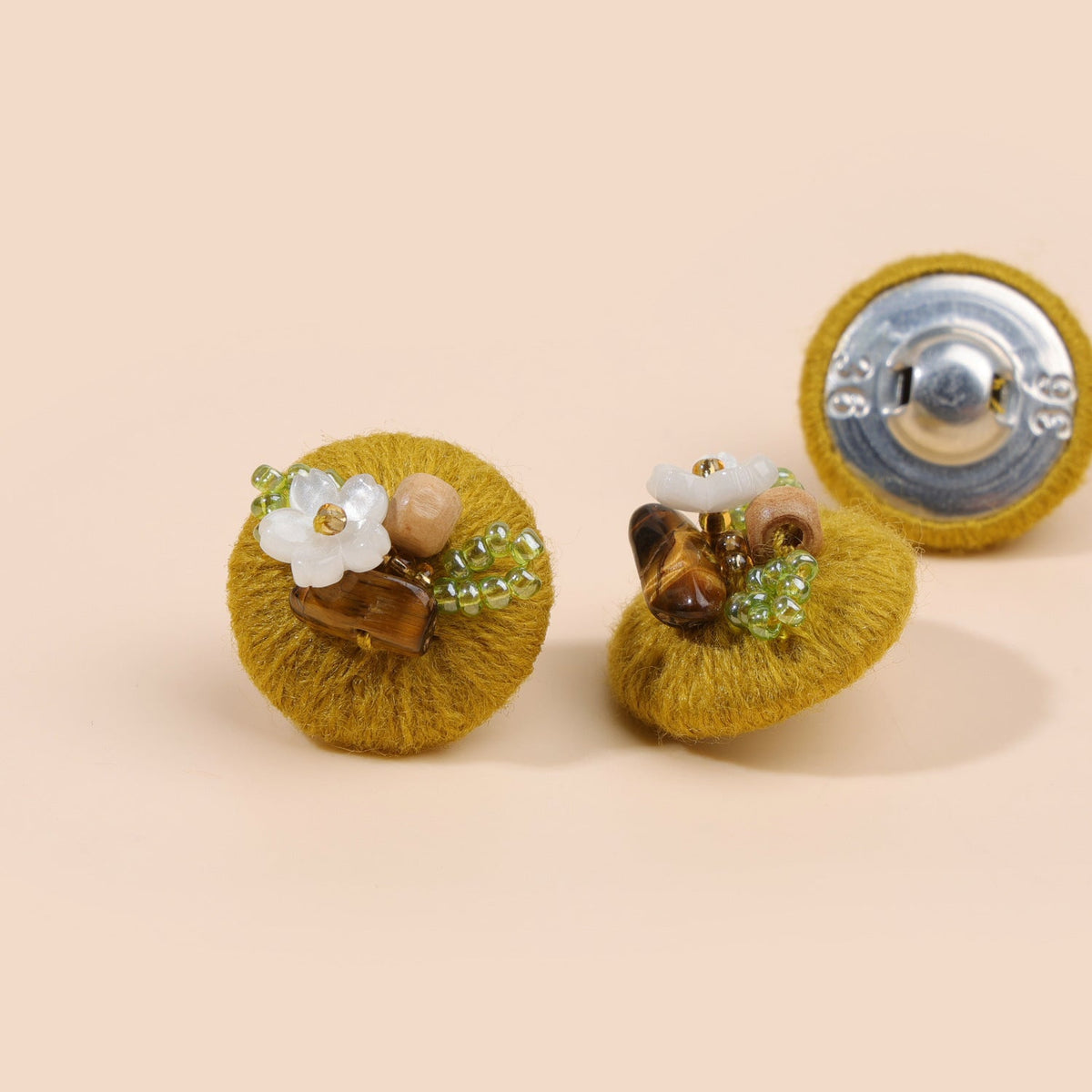 Mustard beaded floral round button from three views