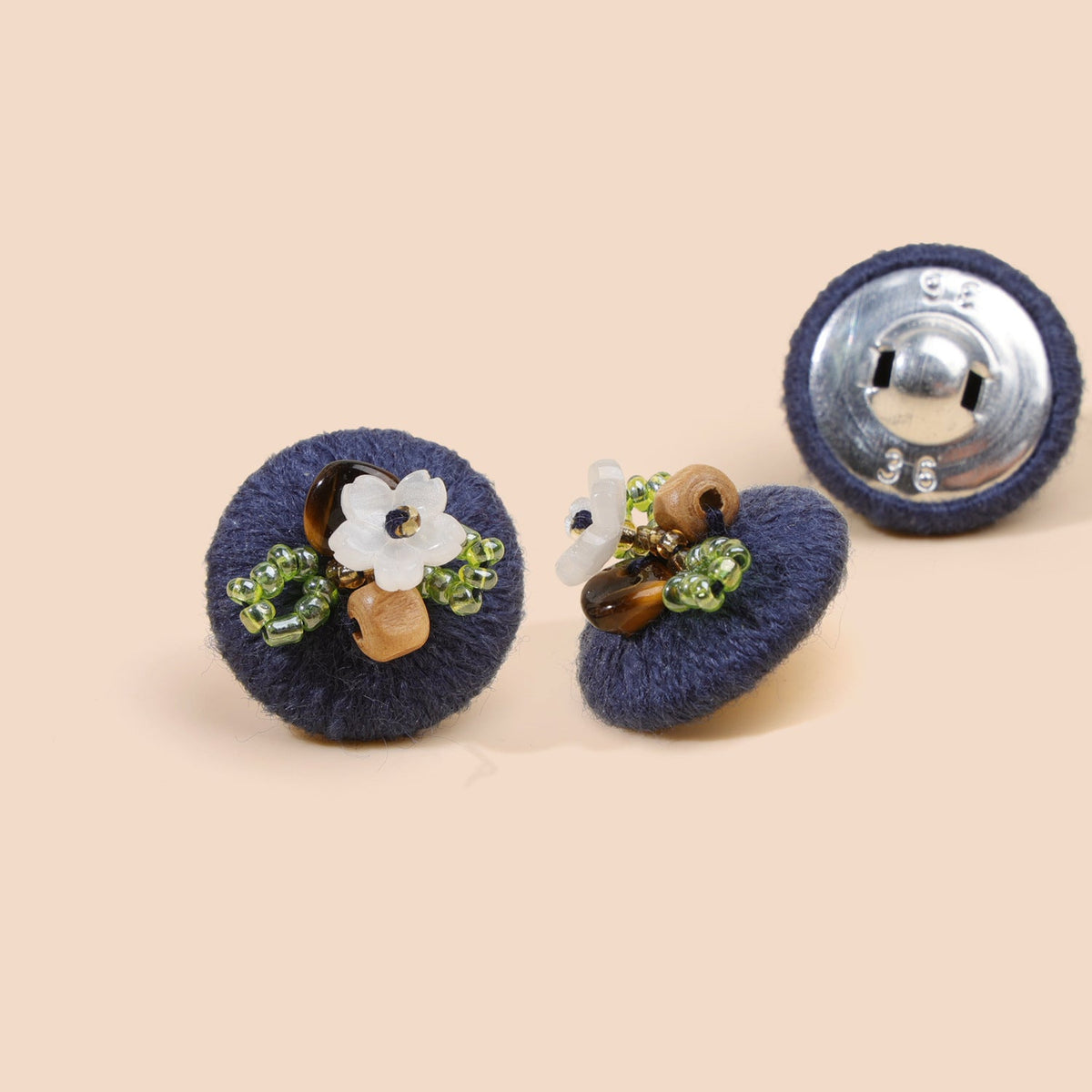 Navy blue beaded floral round button from three views