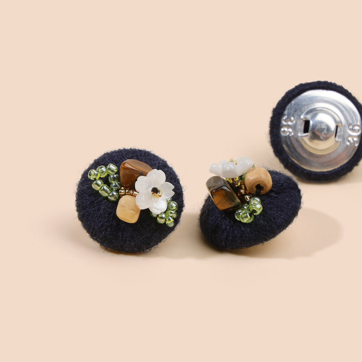 Deep navy beaded floral round button from three views