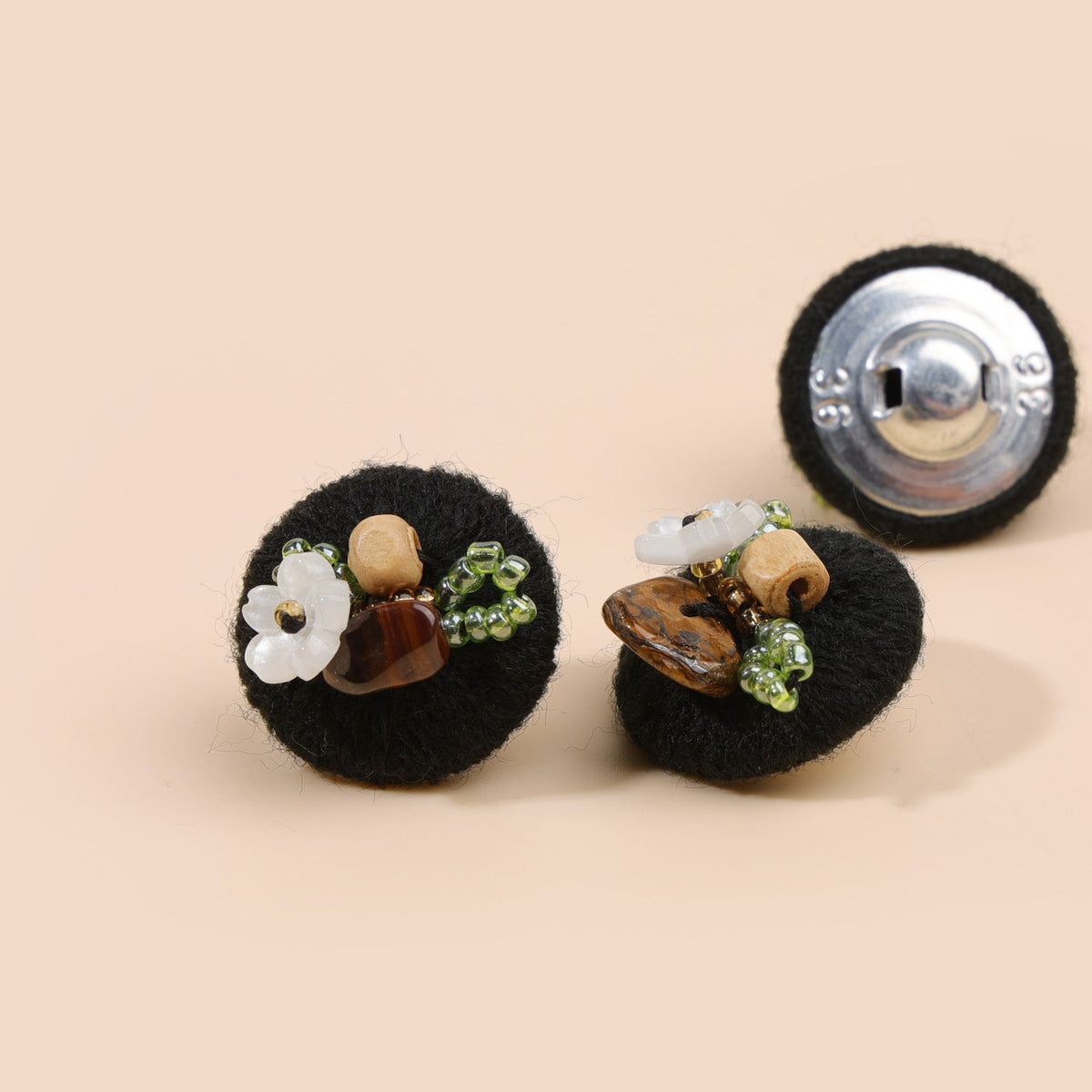 Black beaded floral round button from three views