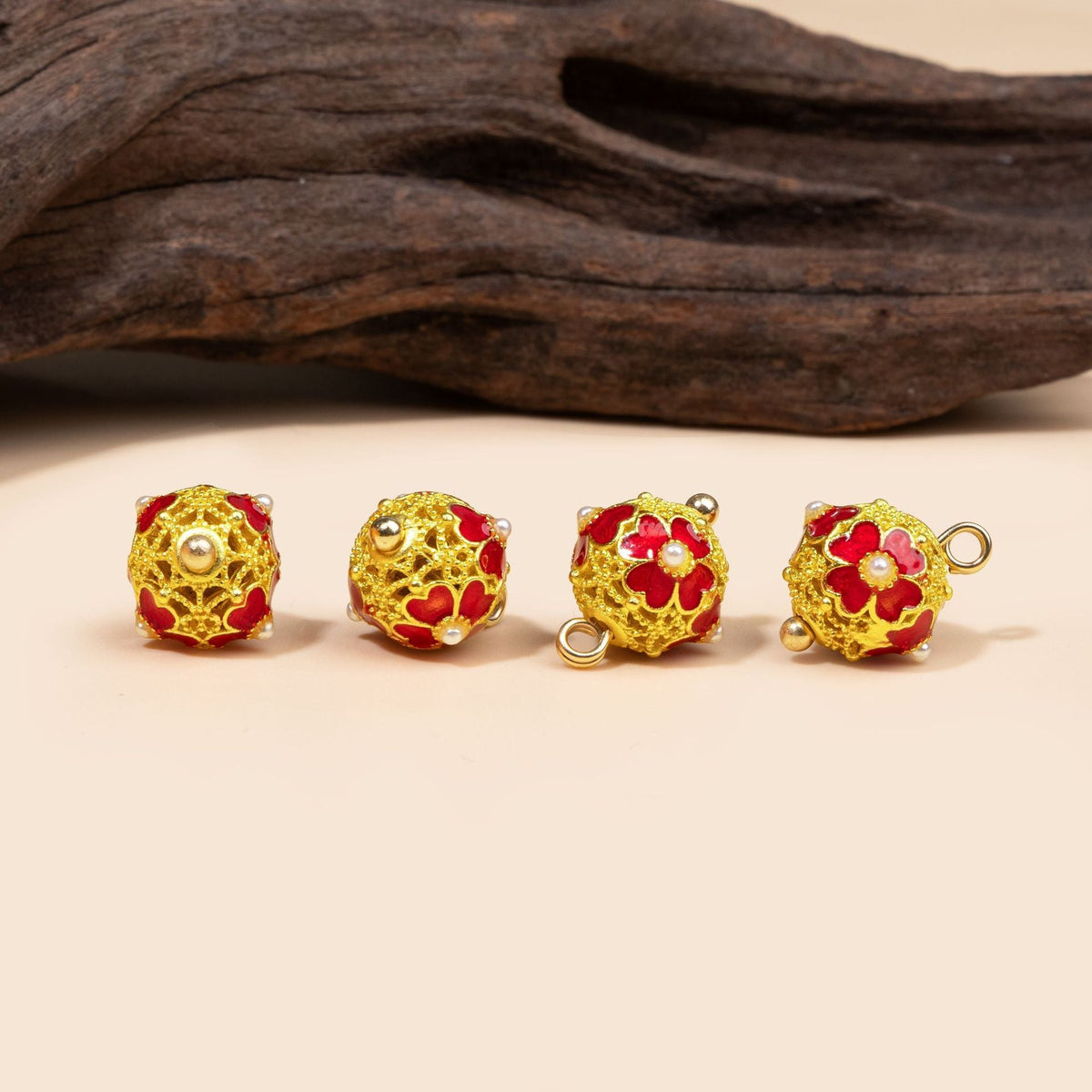 Red filigree floral dome button from four angles