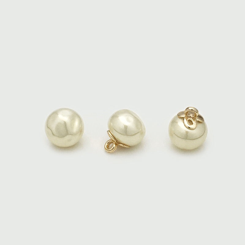Beige rippled orb button shown from three angles