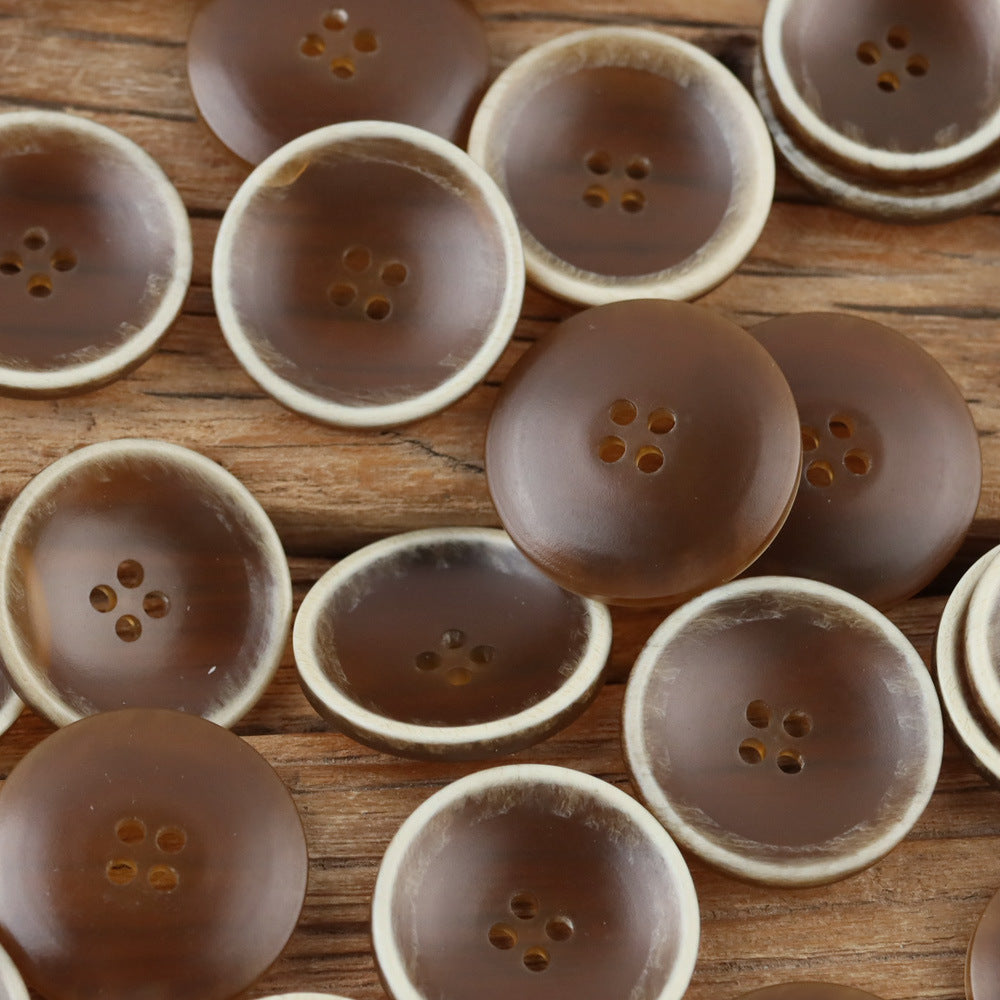 Brown contrast rim bowl buttons on a rustic backdrop