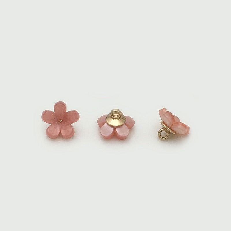 Pink five petal bloom button from three angles