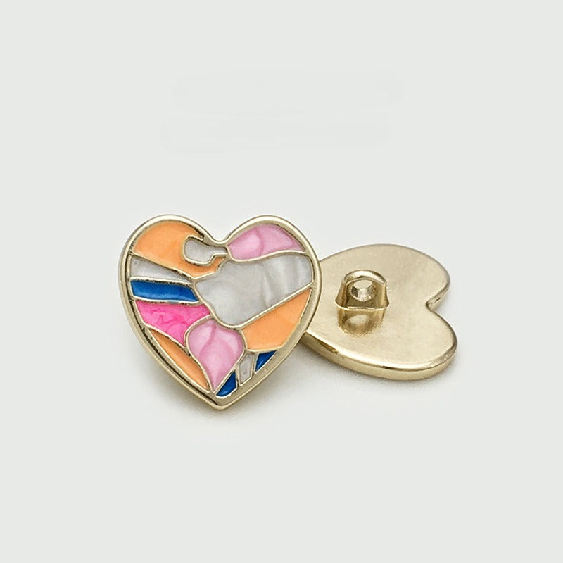 Orange and pink heart-shaped shank button with abstract color panels, shown front and back