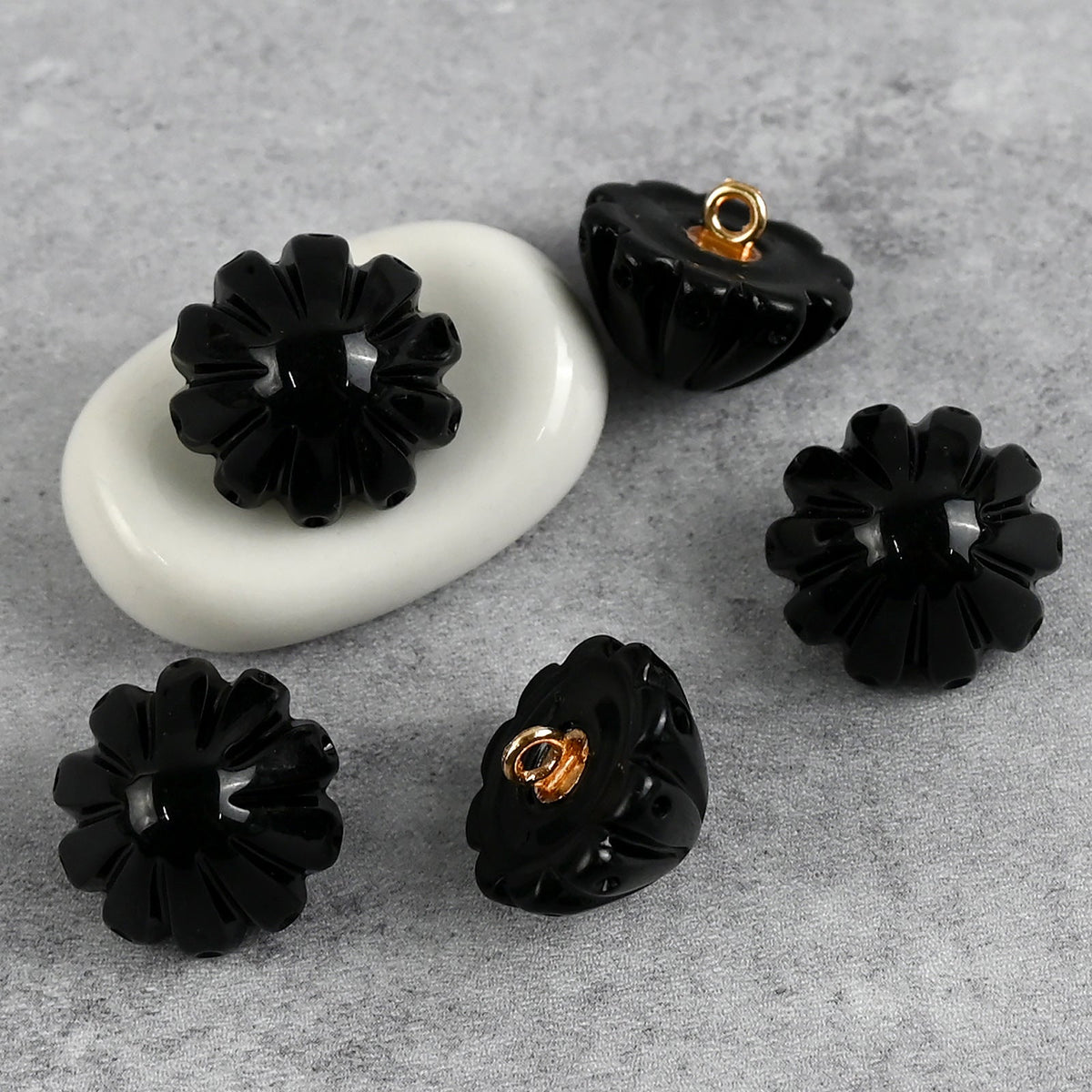 Black fluted dome buttons with gold-tone loop backs