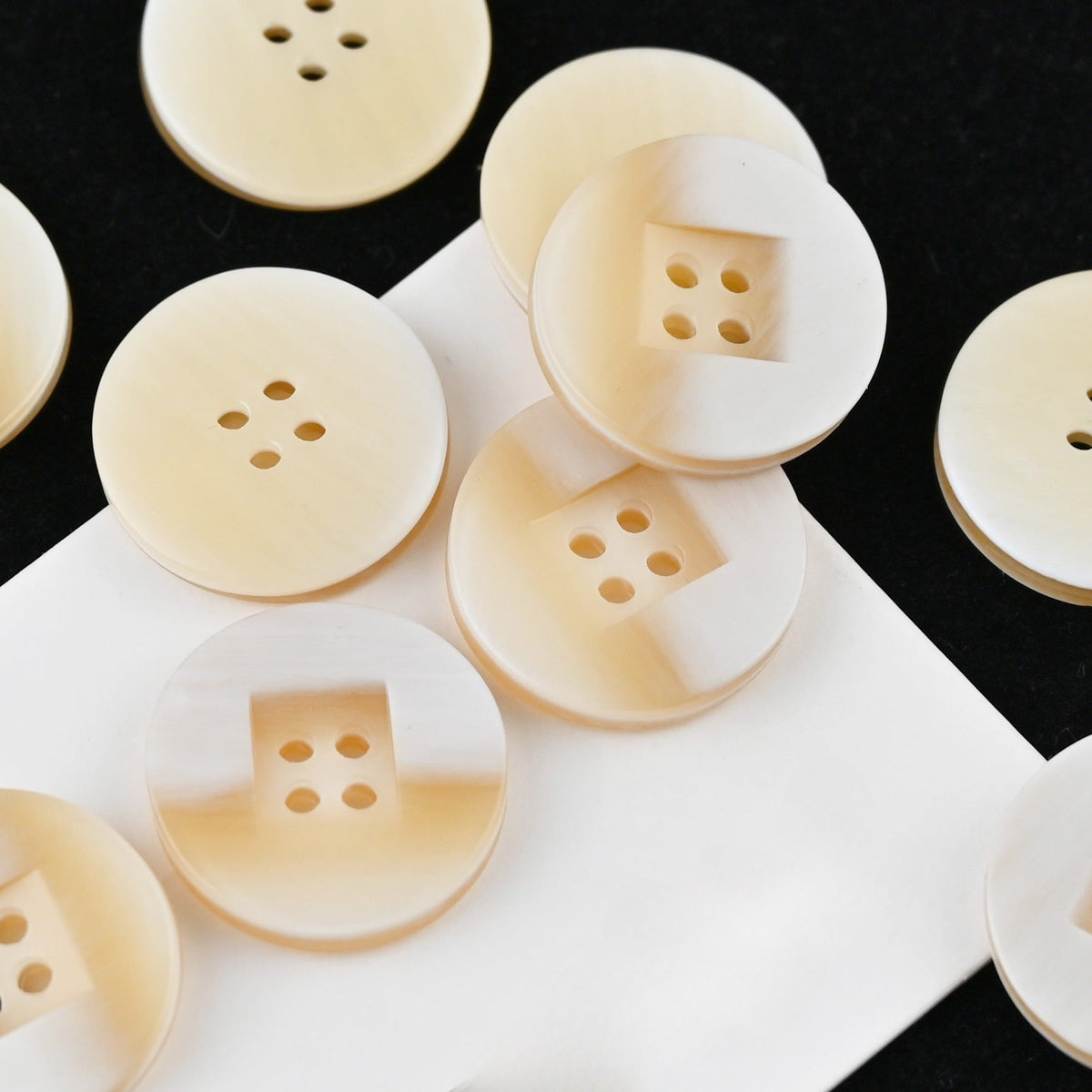 Beige yellow square recess four hole buttons