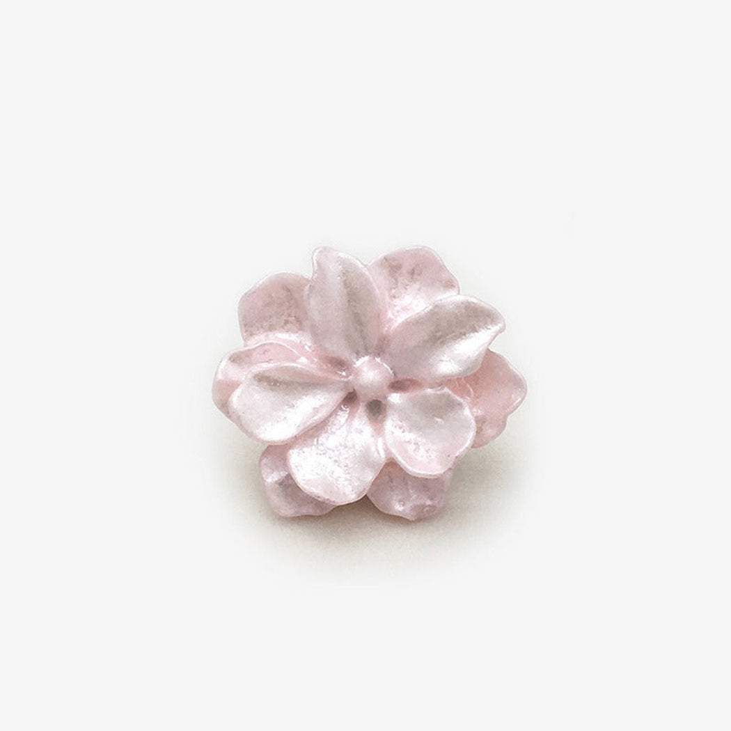 Pink sculpted blossom shank button front view