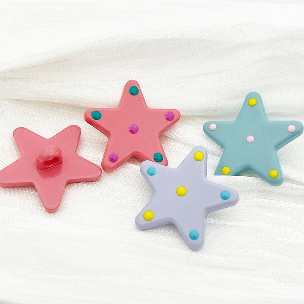 Polka dot star buttons in purple, pink, and blue