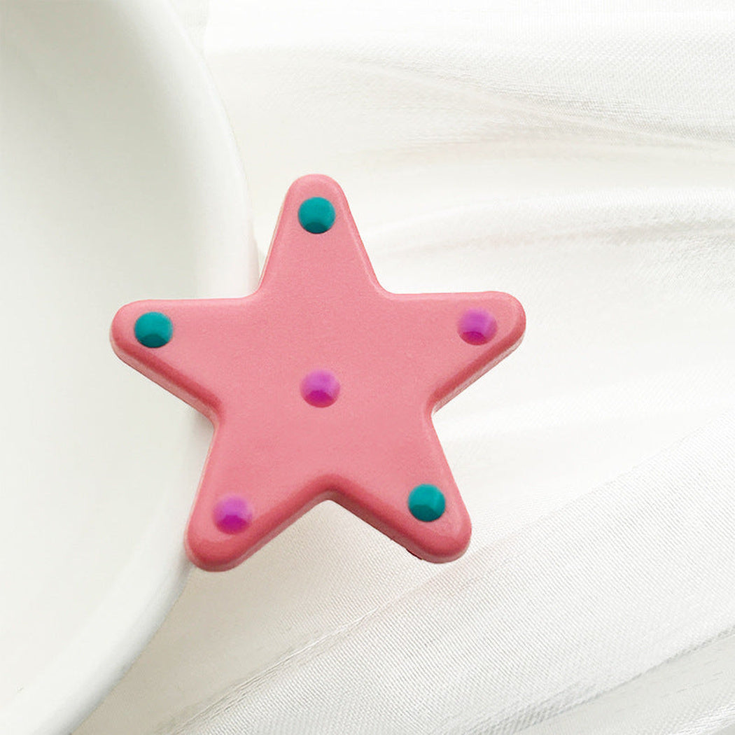 Pink polka dot star button