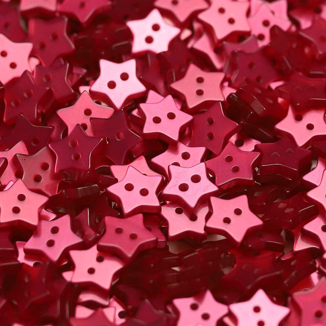 Close-up pile of rose red five-point star two-hole buttons